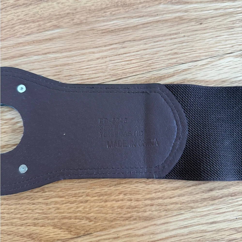 brown elasticated waist cinch belt with a circular buckle